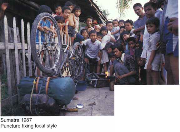 Sumatra 1987 - Fixing a puncture local style