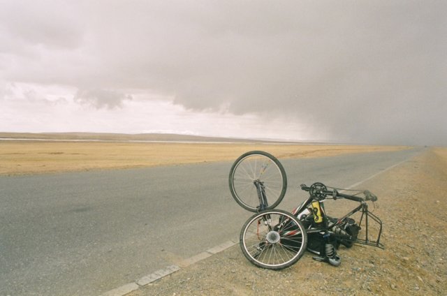 Rear wheel pin snapped just in time for a snow storm. Got a sympathy ride pretty quick, but couldn't a new part till Lhasa. So didn't get to ride a fair part of the way.