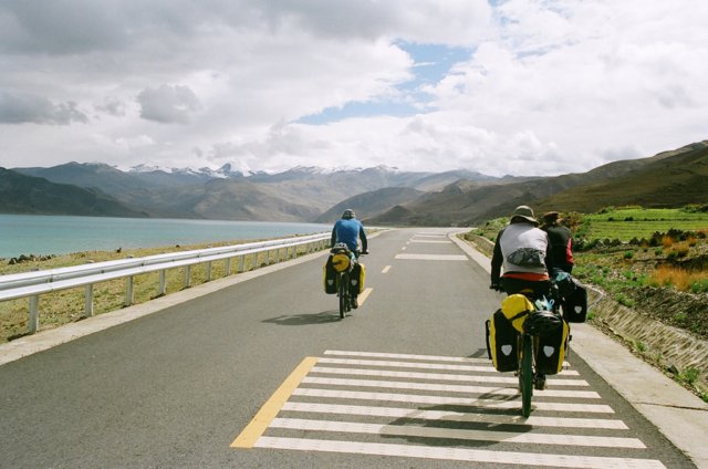 Steve, Shaun, Brice, cruising the new road around Yamdrok Tso. Beautifully smooth.