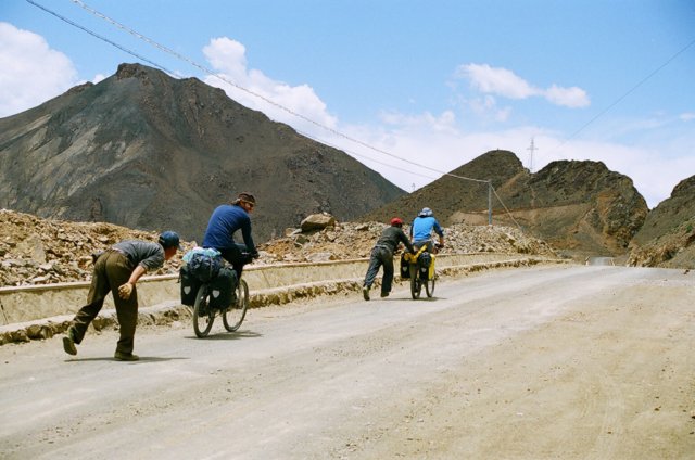 Two randoms ran down from the rock face by the road to give a hand up the hill.