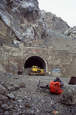 Up to one of the last passes. A pitch black 2km tunnel like a giant walk in freezer. Closed off to cars, got my head torch out and pedaled through slowly.