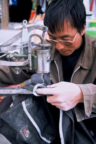 Saga. Boot maker fixing my cheap Chinese pannier.
